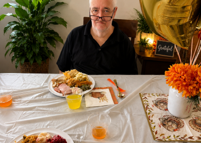 Male ALF resident enjoying a Thanksgiving holiday meal at a licensed assisted living facility in Florida